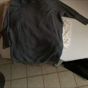 Mid arm length sweater wears a bit longer in the back.